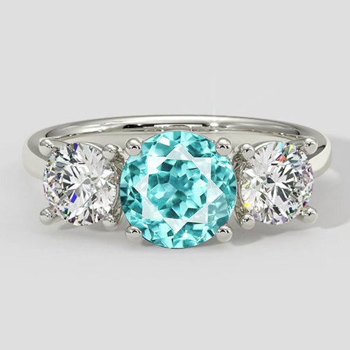 Dreisteinring mit Paraiba-Turmalin und rundem Diamanten