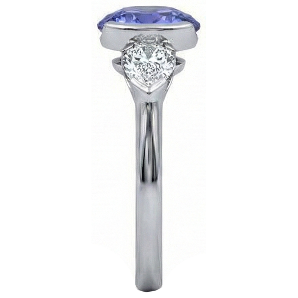Funkelnder 3-Stein-Ring mit 3 Karat Oval Tansanit und Birnendiamant