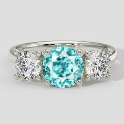 Dreisteinring mit Paraiba-Turmalin und rundem Diamanten