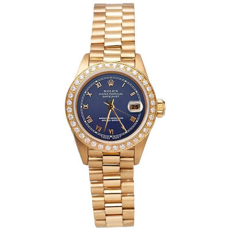 Gelbgold Rolex Damenuhr im Präsidentenstil mit Datum, nur blaues römisches Zifferblatt
