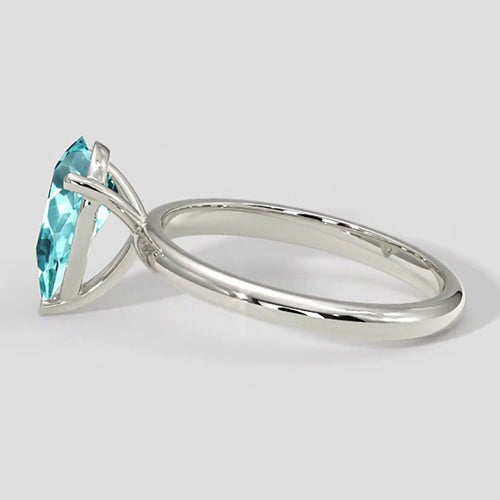 Paraiba-Ring mit Solitärfassung im Tropfenschliff