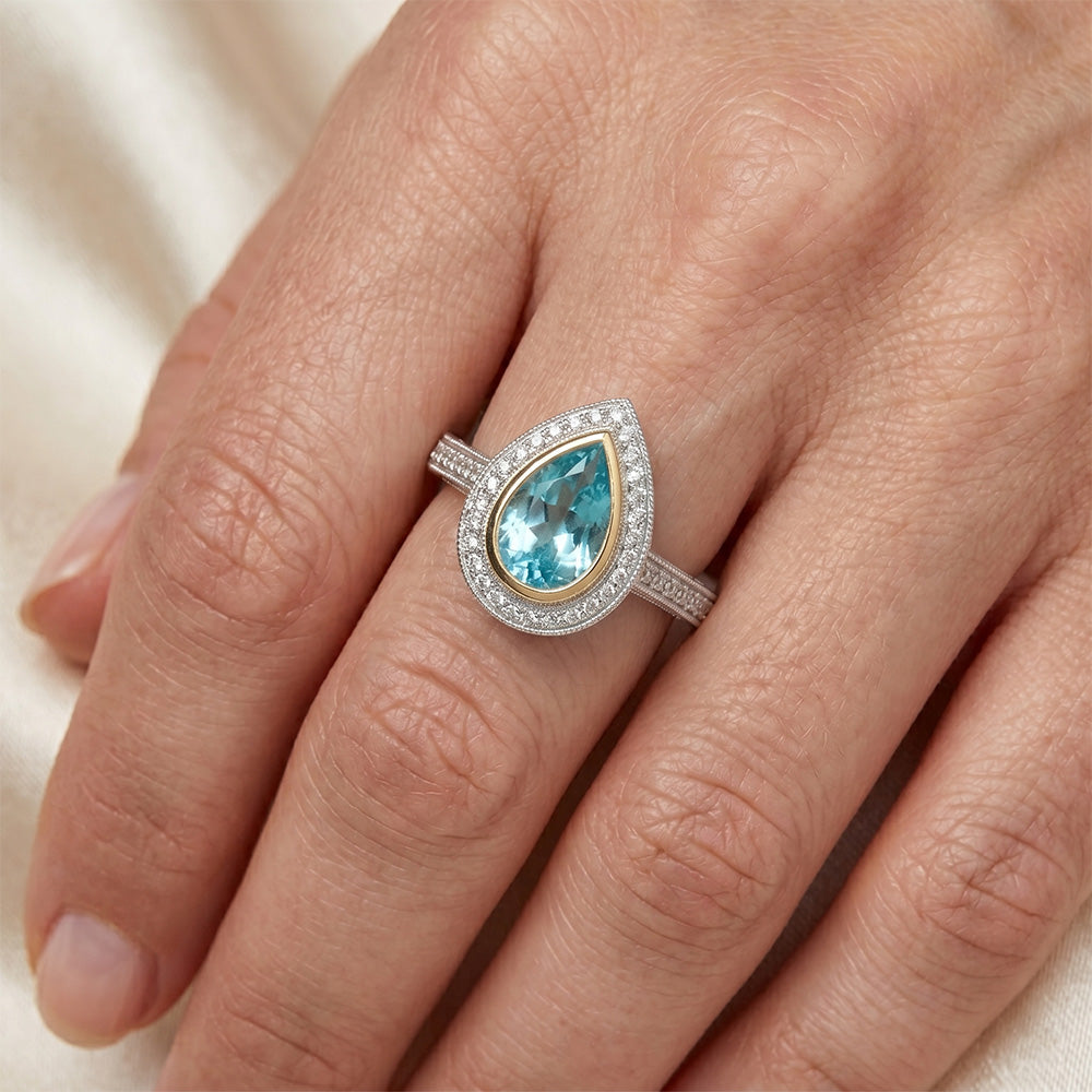 Paraiba-Turmalin VVS Halo-Ring 1,75 Karat in Bicolor 14K Gold