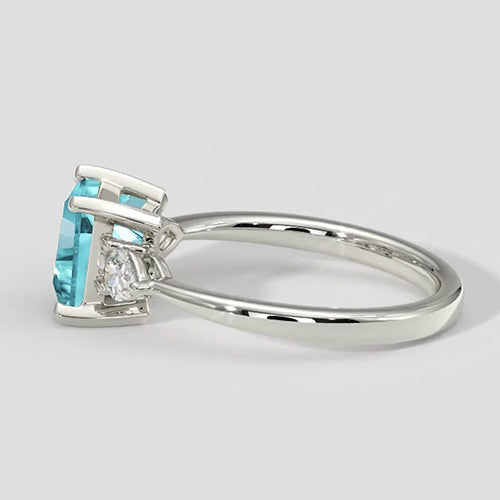 Paraiba-Verlobungsring mit drei Steinen im Kissenschliff