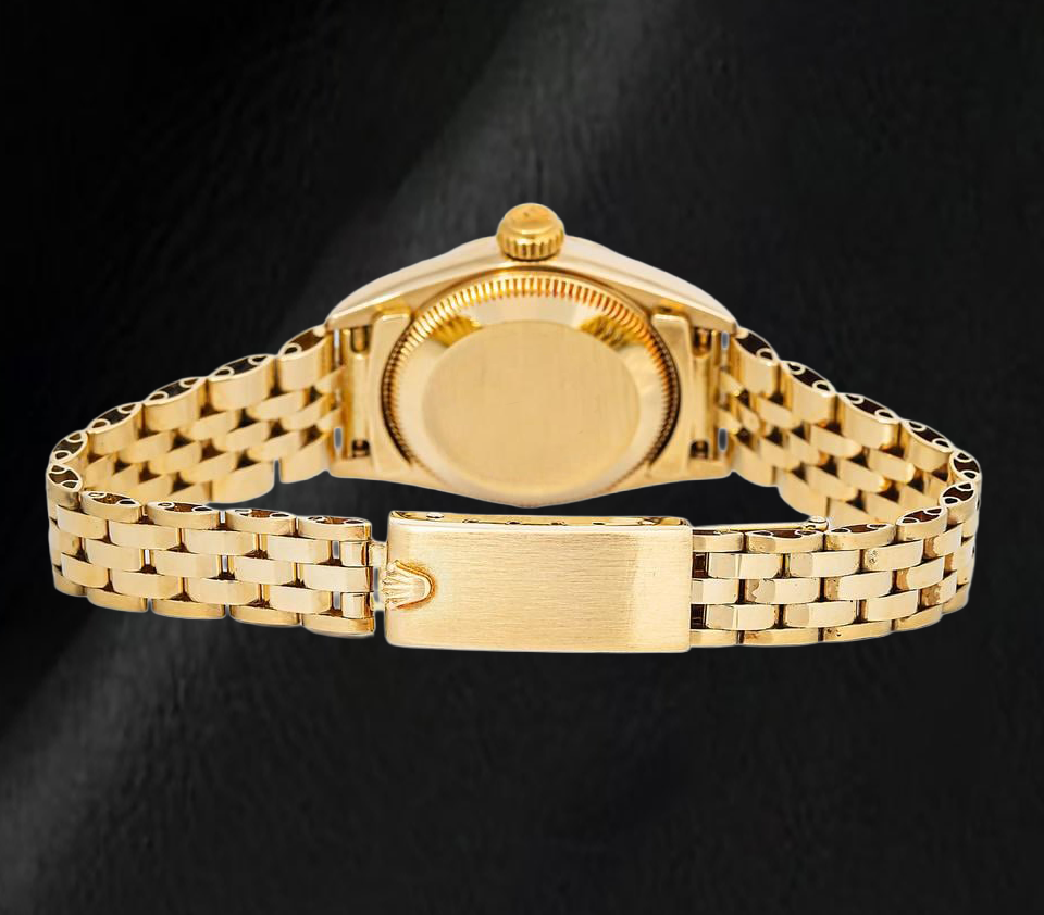 Rolex 67197 Oyster Perpetual Schwarzes Zifferblatt mit Stabindizes 24mm Gelbgold Damenuhr