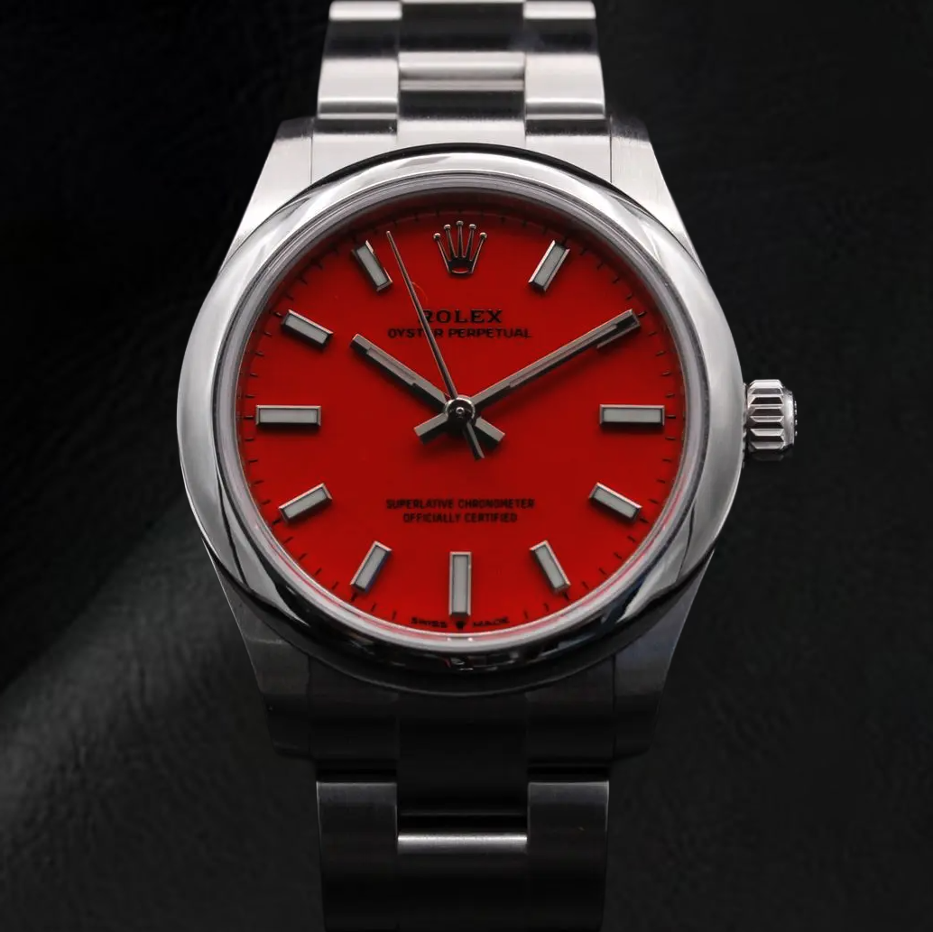 Rolex Dame Oyster Perpetual 31 mm korallenrote Stahluhr mit leuchtendem Zifferblatt