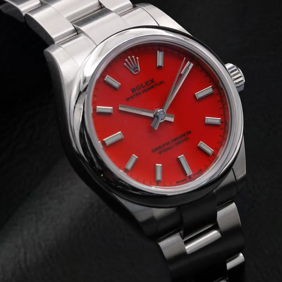 Rolex Dame Oyster Perpetual 31 mm korallenrote Stahluhr mit leuchtendem Zifferblatt