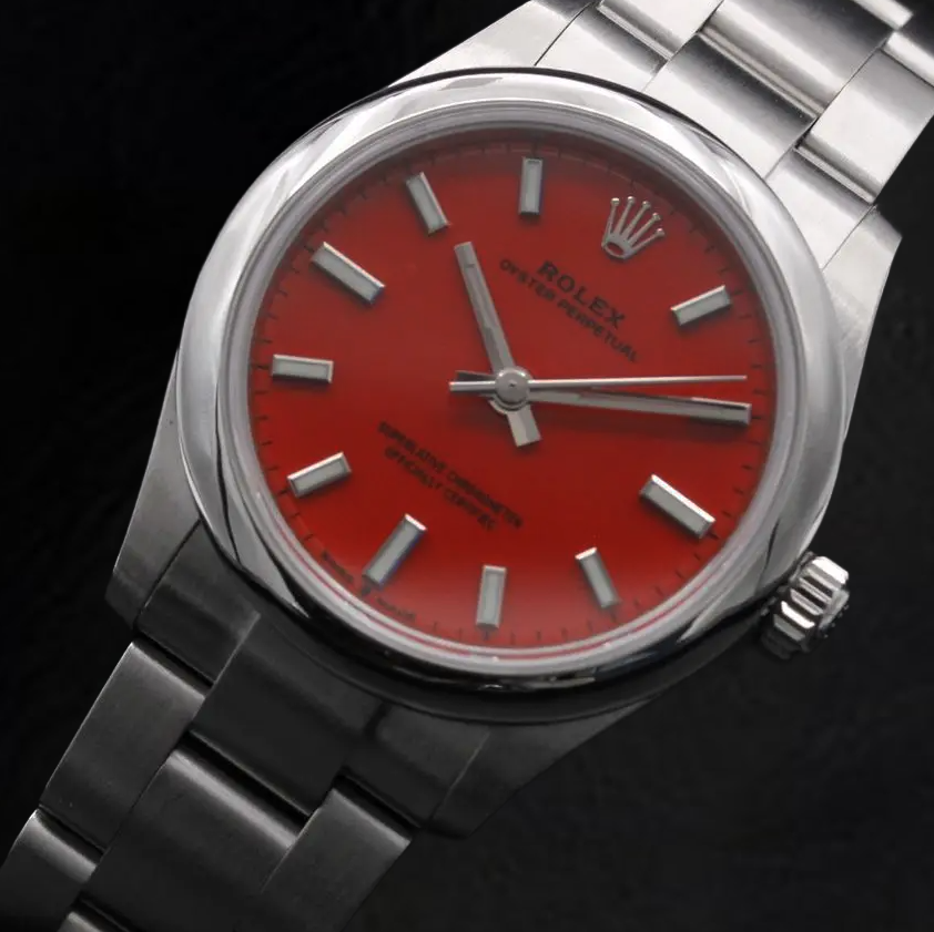 Rolex Dame Oyster Perpetual 31 mm korallenrote Stahluhr mit leuchtendem Zifferblatt