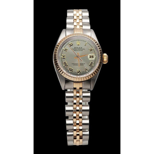Rolex Date Just Damenuhr aus Edelstahl und geriffelter Lünette aus Gelbgold

