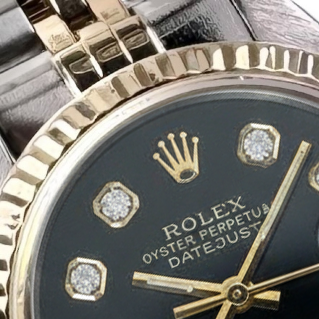 Rolex Datejust-Uhr aus Edelstahl mit geriffelter Lünette und goldenem Baguette-Diamant-Zifferblatt