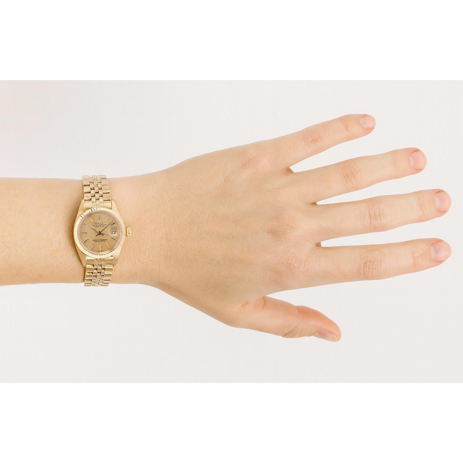 Rolex Datejust 26 mm Damenuhr aus Gelbgold mit champagnerfarbenem Zifferblatt P4