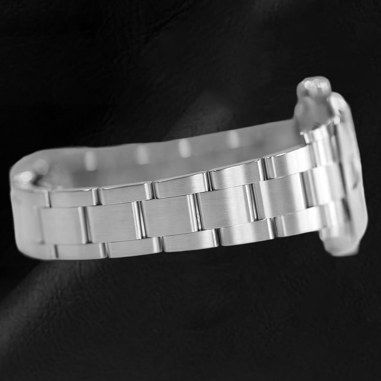 Rolex Oyster Perpetual Korallenrote Stahluhr mit leuchtendem Zifferblatt