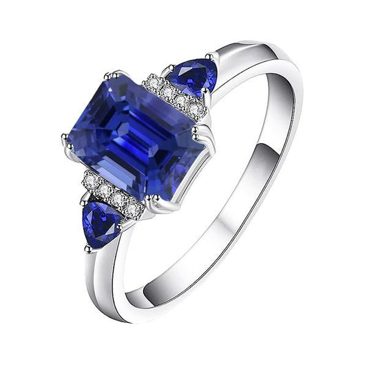 Smaragd-Drei-Steine-Ring mit natürlichem blauem Saphir und Diamanten 3 Karat - harrychadent.de